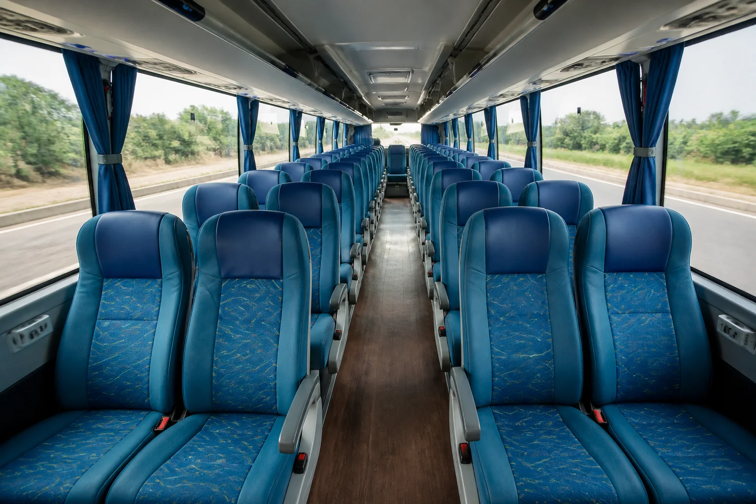 Clean modern AC seater bus interior with comfortable reclining seats