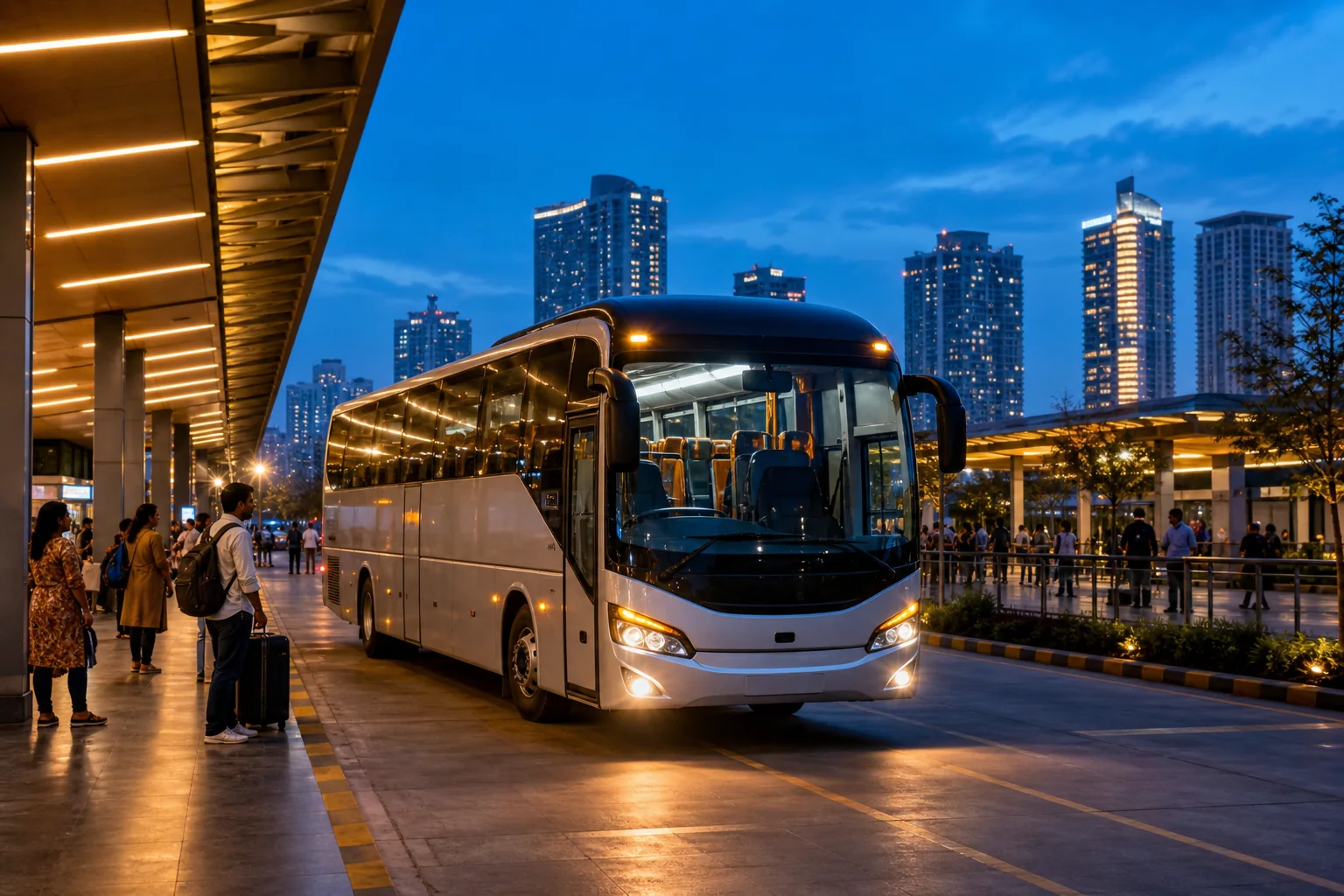 Modern intercity coach arriving at a city bus terminal at blue hour