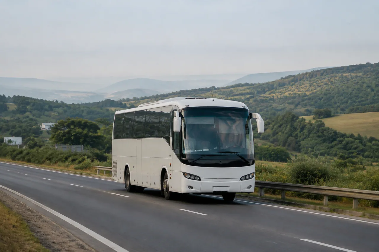 Intercity coach travelling along a road in the Indian countryside
