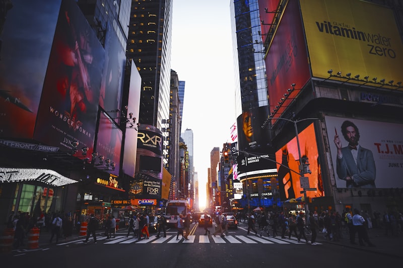 Times Square in New York City with bright billboards and evening traffic